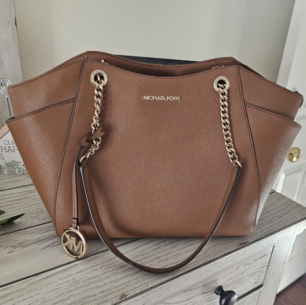 Micheal Khors Brown Leather Shoulder Bag with Chain Strap and Unique Shape